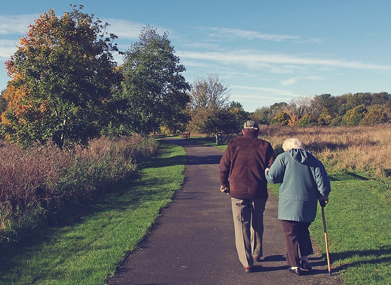 Old Couple Walking Down a Path