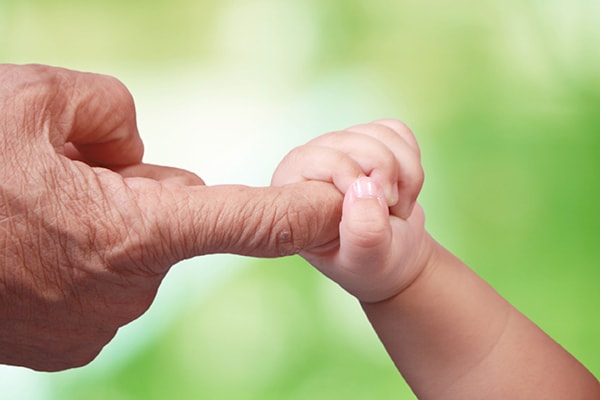 Baby grabbing finger