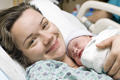 mother holding baby