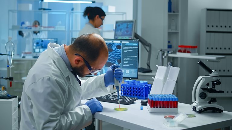 scientist-putting-blood-sample-from-test-tube-with-micropipette-petri-dish-analysing-chemical-reactionRESIZED3.jpg