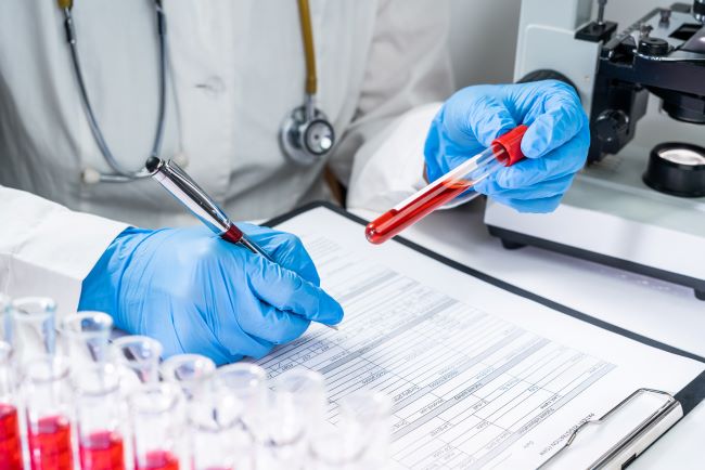 blood-test-tubes-senior-female-scientist-examining-blood-test-tubes-her-laboratory-dna-testing-(1).jpg